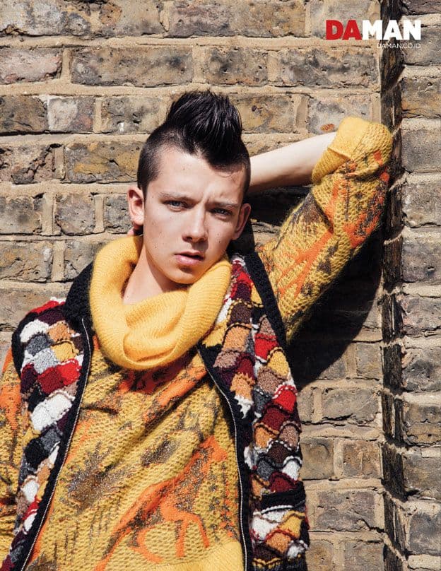 OUTTAKE Asa Butterfield of The Space Between Us in Jumper and pants by Vivienne Westwood, vest and shoes by Prada