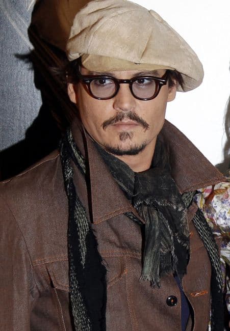 US actors Amber Heard (C) and Johnny Dep