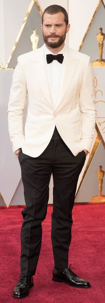 Jamie Dornan in an Hermès suit and Tod’s shoes with a Cartier watch