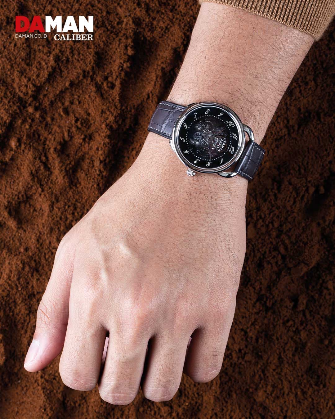  Arceau Squelette in stainless steel with long single tour strap in matte black alligator leather