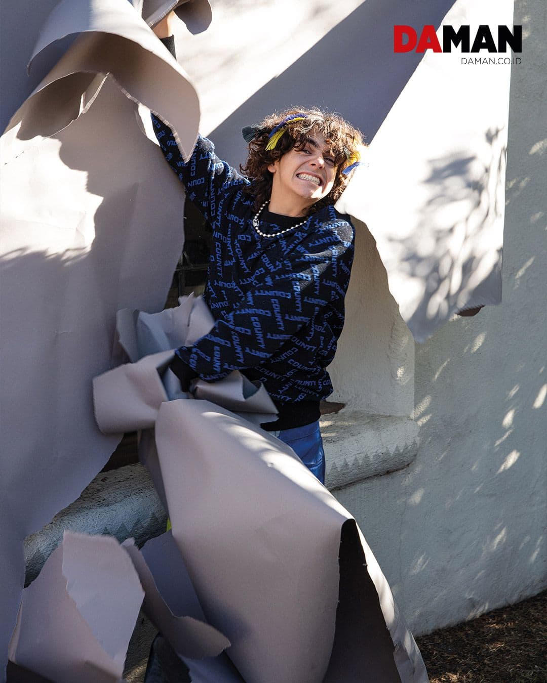  Sweater and pants by Marcelo Burlon; shoes by Golden Goose; necklace by AD.iii