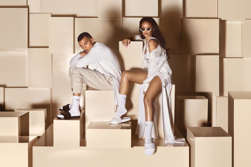 Rihanna modeling fur slides from her Fenty x Puma line.