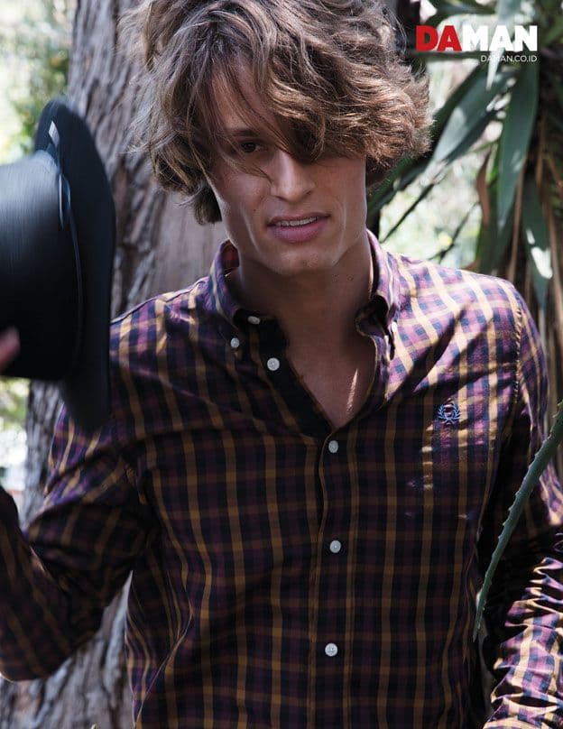 Model Andrew Raymond Thomas in shirt by Fred Perry, hat by contraband hats