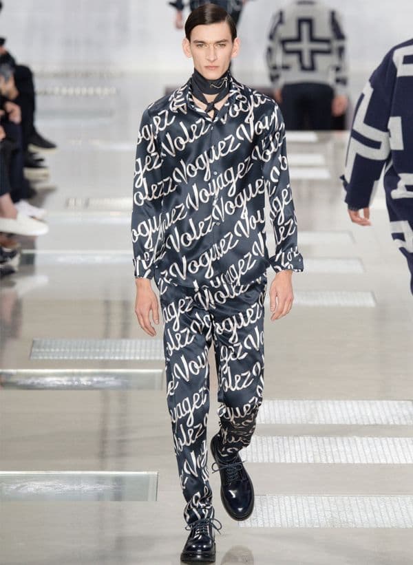 Louis Vuitton’s slogan, “Volez, Voguez, Voyagez,” emblazoned on the clothes