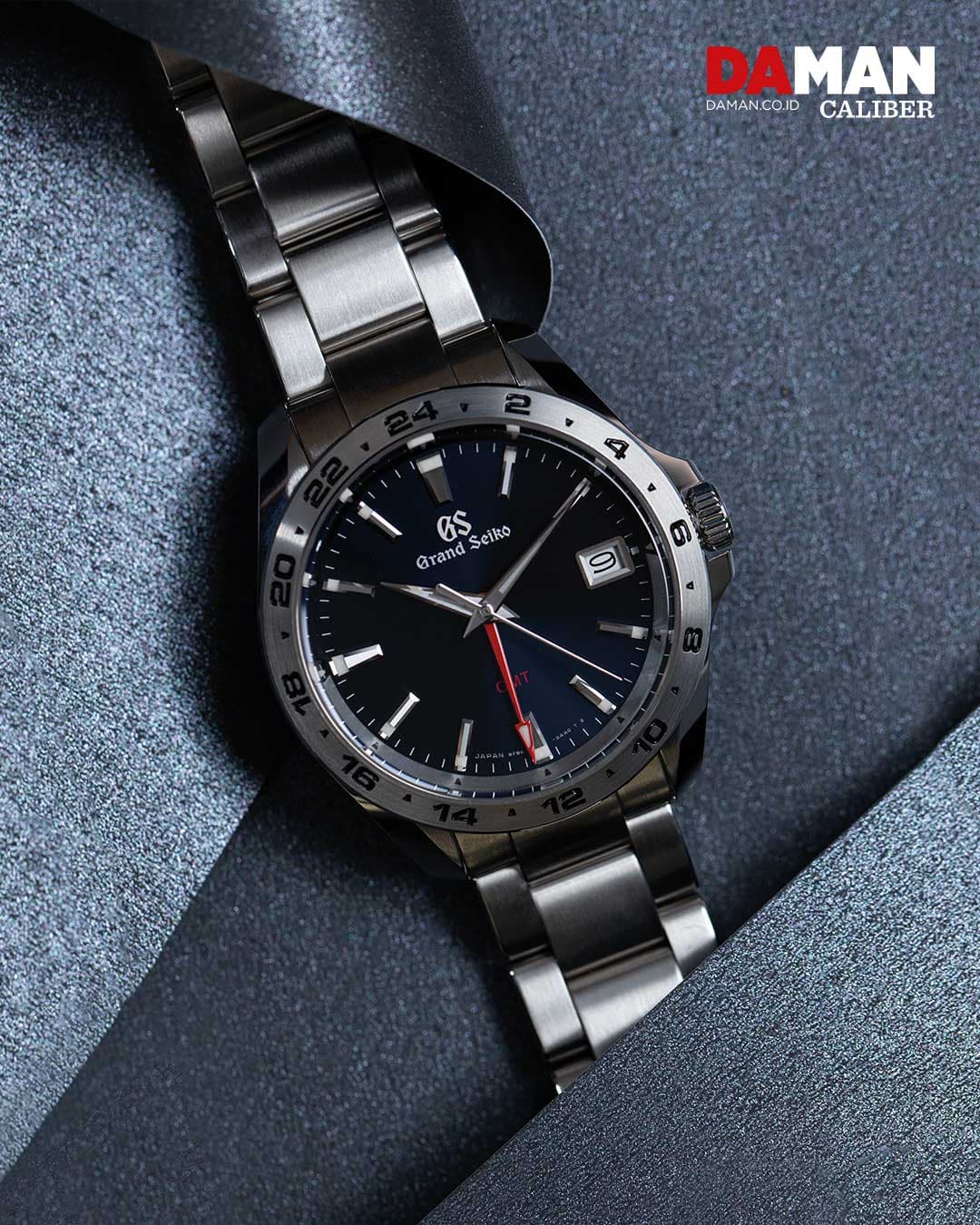 Grand Seiko Sport Collection GMT SBGN005 in stainless steel with steel bracelet