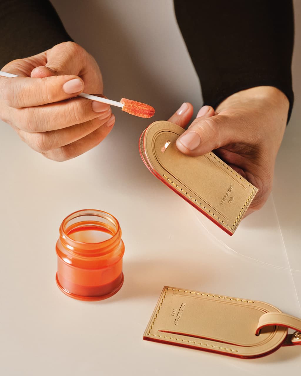 A luggage tag being customized