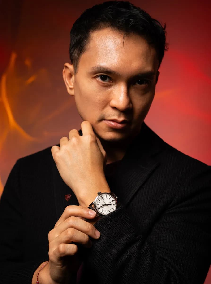 Anggraito Suhartono wearing the Grand Seiko Automatic Mechanical GMT SBGM255 with the “Snowdrop” dial from the Elegance Collection