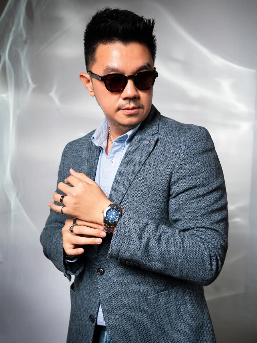 Fredi Wong wearing the Grand Seiko Spring Drive U.F.A. Ushio 300 Diver SLGB023 with blue dial from the Evolution 9 Collection